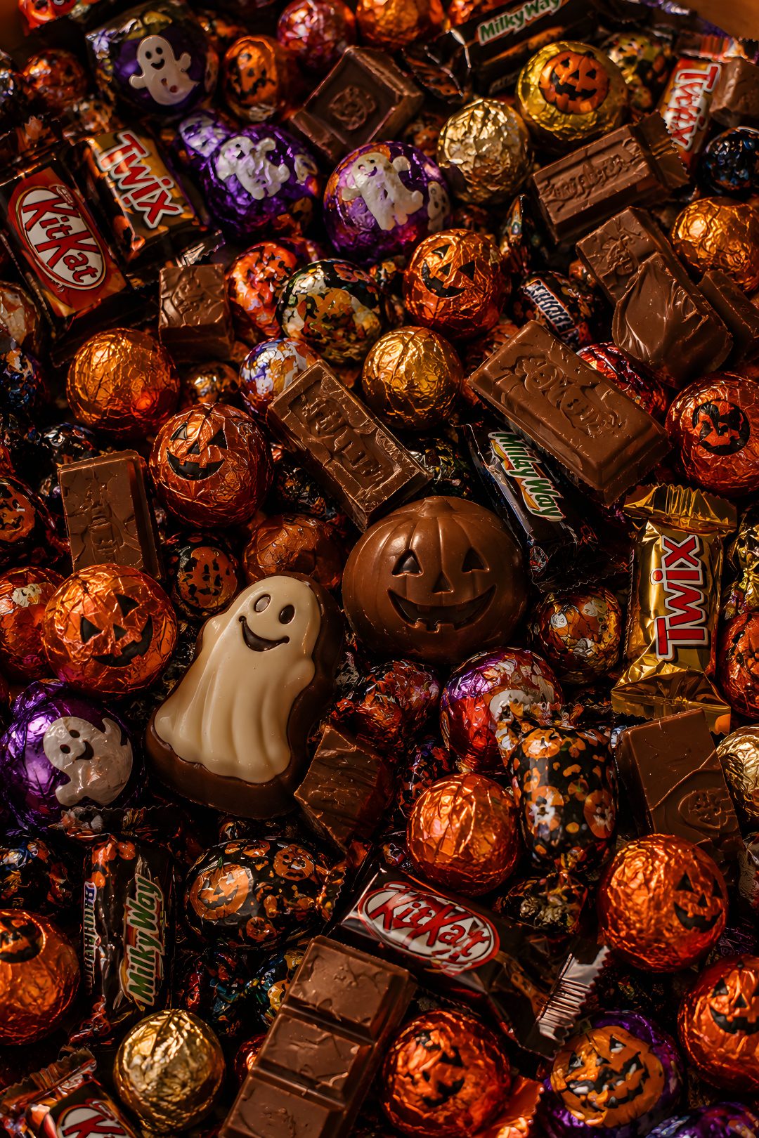 halloween candies and chocolates are piled together Halloween Candy maroon
