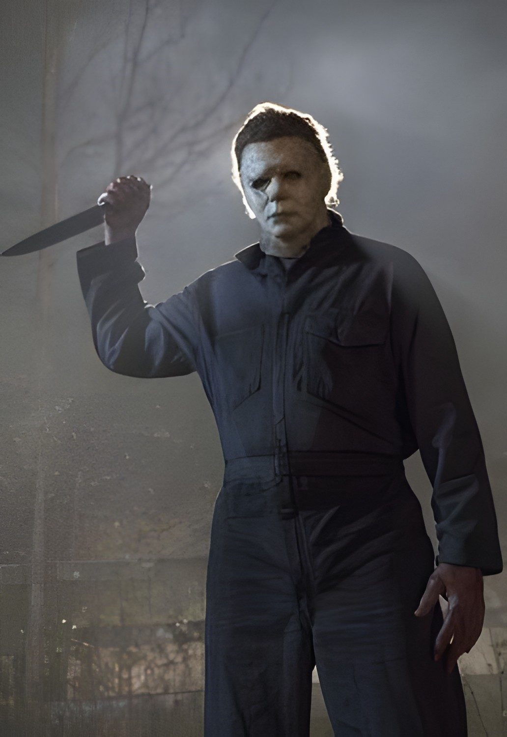 a man with a knife in his hand Halloween 1978 Michael Myers dim gray