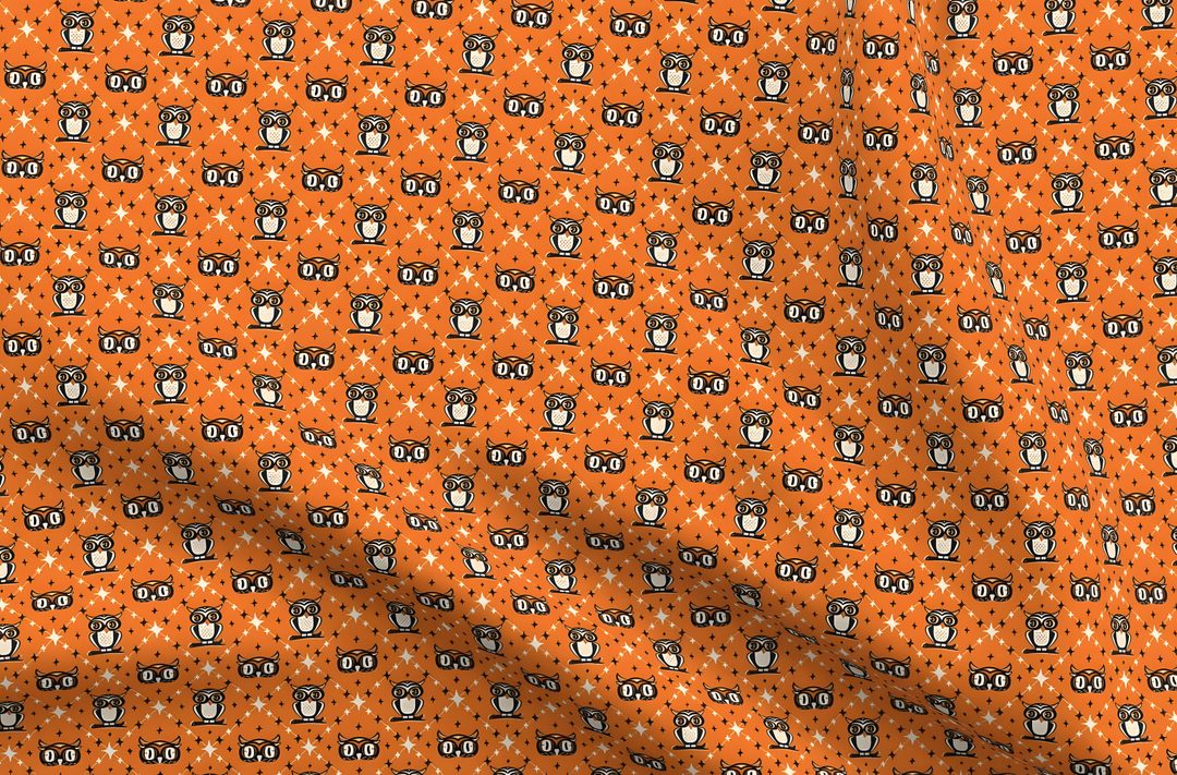 an orange and black patterned fabric with small circles on the bottom, which is very similar to Owl Argyle - Retro Halloween Orange chocolate