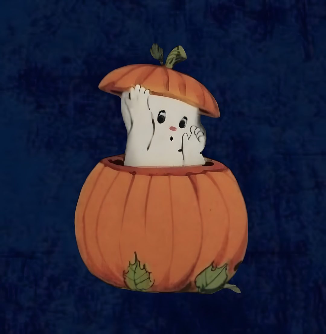 a white cat in a pumpkin costume on a blue background with green leaves and branches Halloween Widget Ideas black
