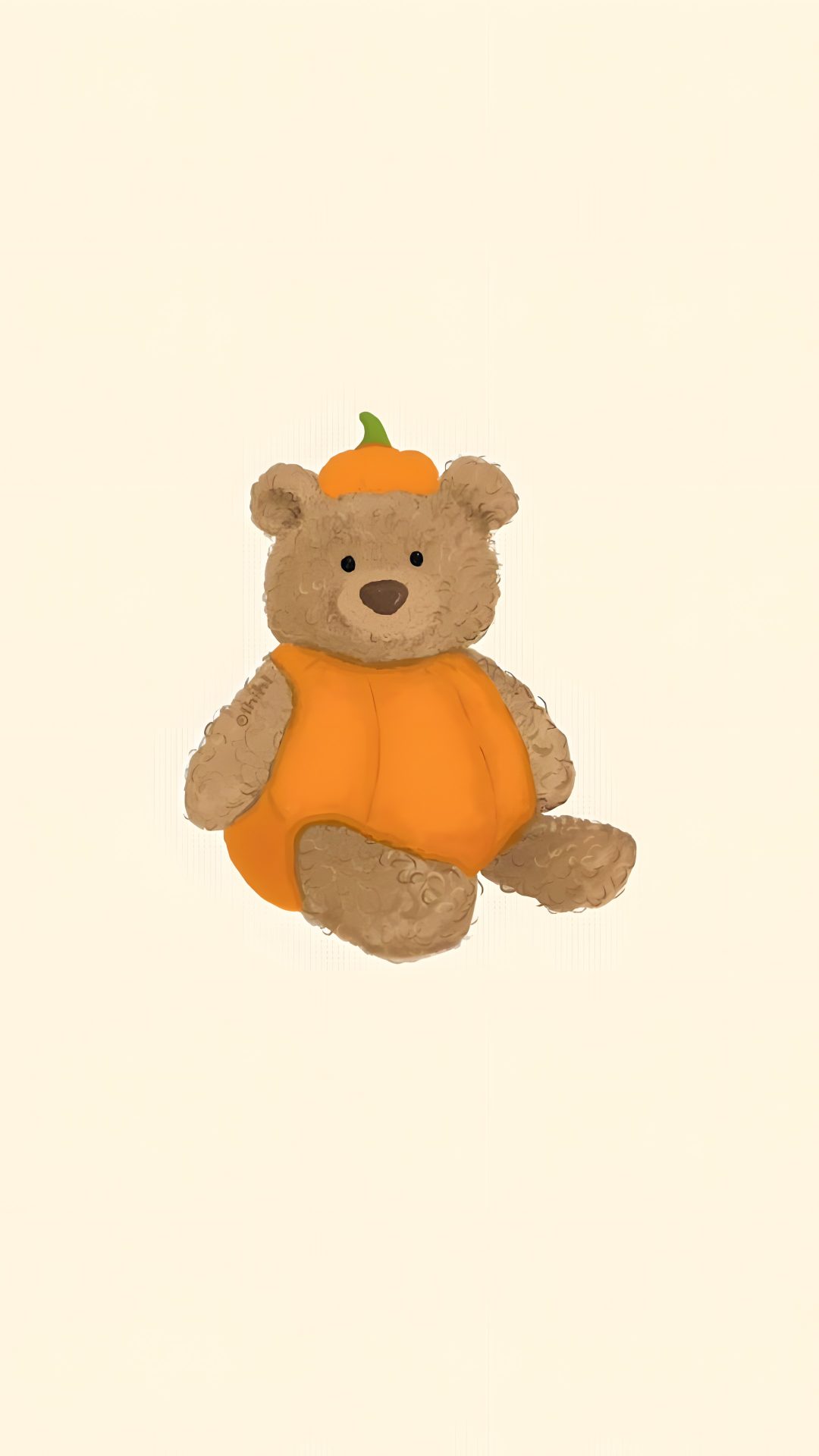 a brown teddy bear sitting on top of a white floor next to an orange pumpkin Jellycat Halloween old lace