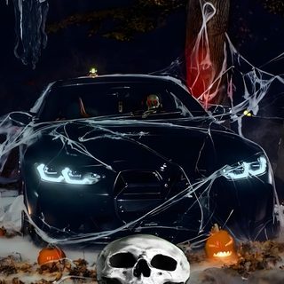 a car decorated for halloween with pumpkins and spider web Bmw Halloween black