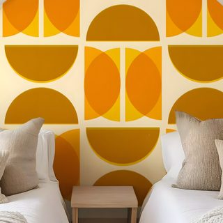 two beds in a room with orange and yellow wallpaper Halloween Circle Geometric In Ochre peru