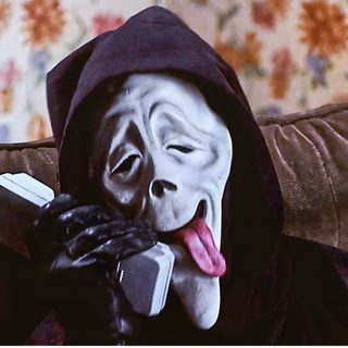 a person wearing a mask and holding a cell phone to their face while sitting on a couch Halloween Scream Funny Funny Scary Movies, Marlon Wayans, Scary Movie Characters, dark slate gray