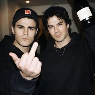 two young men holding up wine bottles and making the peace sign with their hands in front of them Halloween Duo Tvd Reaction Pics, Aesthetic Tvd, Damon And Stefan Salvatore, Tvd Poster, Tvd Icons, black