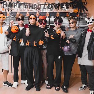 a group of people standing next to each other in front of a wall with halloween decorations Bts Halloween Laptop Hottest 100, Foto Jungkook, Bangtan Boys, Varsity Jacket, Bts, gray