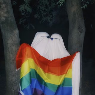 there is a white ghost wrapped in a rainbow colored blanket next to some trees at night Gay Halloween Gay Ghost Costume, Bi Ghost, Rainbow Ghost Costume, Gay Halloween, Pride Ghost, dark slate gray