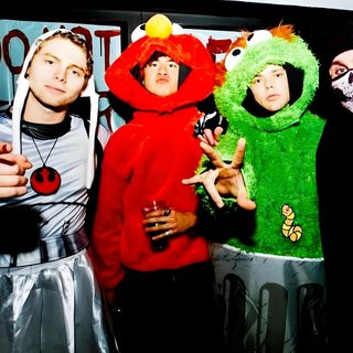 three people dressed up in costumes posing for a photo with one person wearing a costume 5sos Halloween 5sos Halloween, 5sos Fall Aesthetic, 5sos Playlist Cover, 5sos Halloween Costumes, black