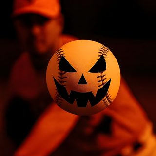 a baseball with a jack - o'- lantern face on it is in the air Baseball Halloween Event Planning Tips, Baseball Birthday Party, Dodgers Baseball, High Stakes, black
