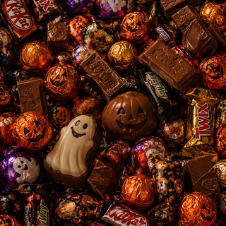 halloween candies and chocolates are piled together Halloween Candy maroon