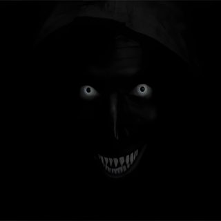 an evil looking person wearing a hood in the dark Scary Halloween Background For Mac Scary Laptop, Scary For Laptop, Scary Smile Gif, black