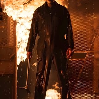 a man standing in front of a fire Mike Myers Halloween Halloween Aesthetic Michael Myers, Halloween Michael Myers Aesthetic, Michael Myers Fire Pfp, maroon