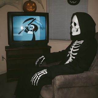 a skeleton sitting in front of a tv wearing a hoodie and holding a bat Vhs Halloween Halloween Pfp Skeleton, Cool Skeleton Pfps, Scary Skeleton Pfp, dark slate gray