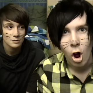 two young men with their faces painted to look like cats Dan And Phil Halloween 2009 Dan And Phil Cat Makeup, Dan And Phil Halloween, Dan And Phil Photobooth, dark slate gray