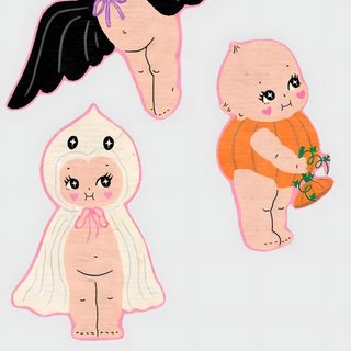 three small stickers with angels on them, one in the air and one in the ground Kewpie Halloween gainsboro