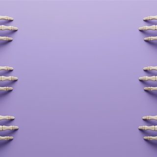 there are five bones in the shape of hands on a purple background with space for text Halloween Skeleton Hand Purple dark gray