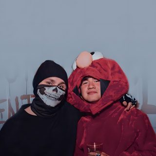 two people dressed in costumes pose for a photo with their arms around each other, both wearing face paint 5sos Halloween 5sos Halloween, 5 Seconds Of Summer Photoshoot, 5 Seconds Of Summer Group Photo, light slate gray