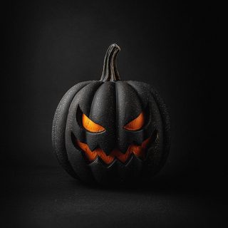 a black pumpkin with glowing eyes on it's face, in the middle of a dark background Apple Halloween 4k Dark Halloween 4k, Halloween Black, Halloween Black Background, Black Halloween 4k,