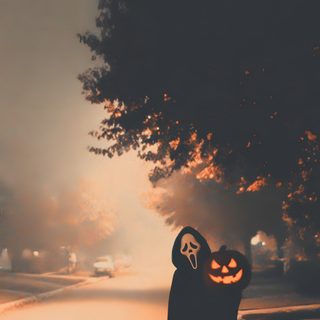a person holding a jack o lantern on the side of a road with trees in the background Halloween Aesthetic Scream Halloween, Photo Halloween, Halloween Iphone Backgrounds, dark olive green