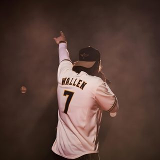 a baseball player holding his arm up in the air while wearing a white shirt and black pants Morgan Wallen Halloween Morgan Wallen One Thing At A Time, Morgan Wallen Pictures For Wall Collage, Morgan Wallen Lyrics 98 Braves, dark slate gray