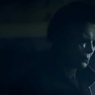 a man standing in the dark with his head turned to the side, staring at something Halloween 2018 Michael Myers 2025, Michael Myers 2018, Michael Myers Banner, black