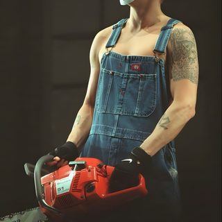 a man in overalls and a mask holding a power tool with one hand on his hip Eminem Halloween Slim Shady Jason Mask, Eminem Overalls, Eminem Jason Mask Drawing, dark slate gray