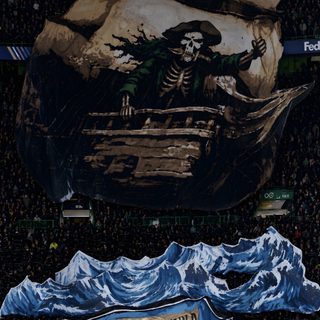 an image of a banner in the middle of a soccer field that reads celtic we've formed the world around and round Halloween Celtic black