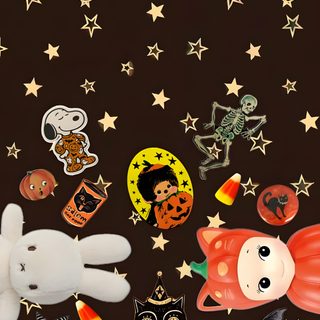 several halloween pins and stickers on a black background with stars in the shape of pumpkins Baggu Halloween black