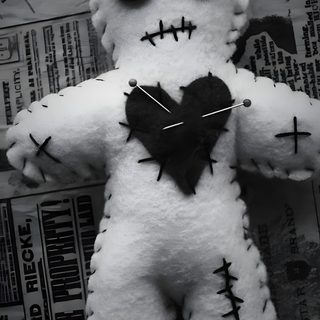a stuffed animal with buttons on it's face and eyes, sitting on top of newspaper Halloween Voodoo Doll Vudu Doll, Voodoo Doll Aesthetic, Voodoo Dolls Aesthetic, dark slate gray