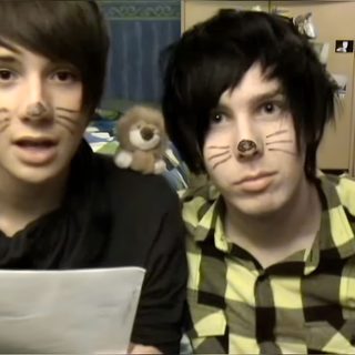 two young men with fake cats on their faces Dan And Phil Halloween 2009 2009 Dan And Phil, Dan And Phil, dark olive green