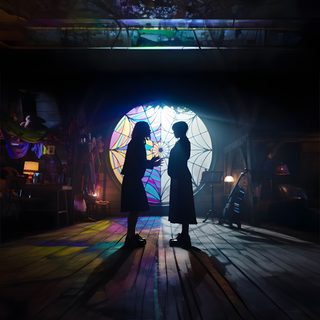 two people standing in front of a window with an umbrella projected on the wall behind them Wednesday Halloween Wednesday Addams Quotes, Adams Family, Halloween Iphone Backgrounds, black