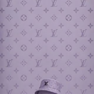 a small toy is standing in front of a wall with louis vuitton designs Louis Vuitton Halloween Iphone dark gray