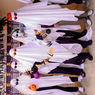 a group of people standing next to each other in front of a wooden table with halloween decorations on it Bts Halloween Laptop Bts Theme, Bts Thanksgiving, Bts Pumpkin Painting, Bts Fall, Bt21 Halloween, rosy brown
