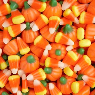 a pile of orange and yellow candy corn Halloween Candy Corn Halloween Candy Corn Taffy, Colorful Halloween Candy Corn, Autumn Mix Candy Corn, chocolate