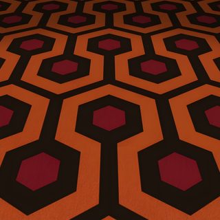 an orange and black carpet with hexagonal shapes The Shining Laptop Halloween The Shining Carpet, Shining Carpet, The Shining Carpet Pattern, maroon