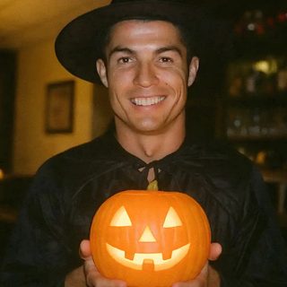 a man in a witches hat holding a carved pumpkin Halloween Soccer Cristiano Ronaldo Halloween, Ronaldo Halloween, Pop Art Comic, Halloween Night, black