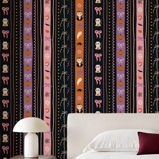 a bed sitting in front of a colorful wallpaper Halloween Trellis Ikat Custom saddle brown