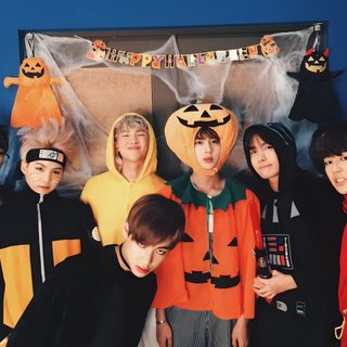 a group of young men standing next to each other in front of a blue wall Bts Halloween Laptop Fall Bts, Bts Thanksgiving, Bts Pumpkin Painting, Bt21 Halloween, dark slate gray