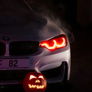 a car with a pumpkin carved into the trunk and headlight on it's side Bmw Halloween Bmw Scary, Bmw Horror, Bmw Pumpkin Carving, Bmw Fall, Bmw Fall Background, Bmw Ghost, black