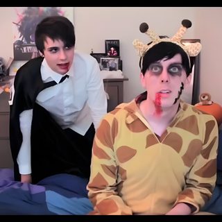 two people dressed up in costumes standing on a bed and one is making a funny face Dan And Phil Halloween 2009 Dan And Phil Fnaf, Dan And Phil Cat Makeup, Dan And Phil Jamaica, gray