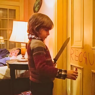 a young boy holding a large knife in his hand and writing on the wall behind him The Shining Laptop Halloween The Shining, The Shining Here Comes Johnny, Classic Horror, chocolate