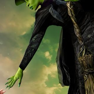 a man in a witches costume is holding onto a tree with his hands as if he was trying to scare him Wicked Halloween Wicked Film, Wicked Witch Of The West, Glinda The Good, Ariana Grande, dark olive green
