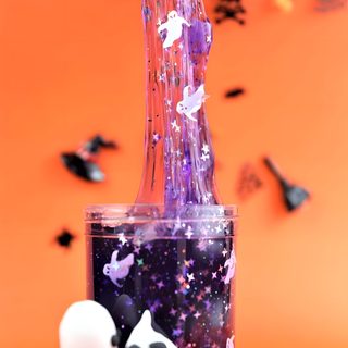 two halloween decorations in a glass vase with purple and white sprinkles on an orange background Halloween Slime Hd Slime Halloween, Lava Lamp, Slime, Novelty Lamp, Table Lamp, Halloween, coral
