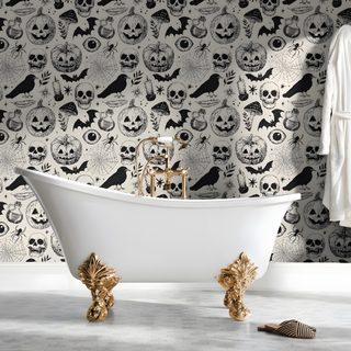a white bath tub sitting next to a halloween themed wall Halloween Themed Bathroom dark gray
