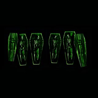 three green suits are shown in the dark Type O Negative And Pantera On Halloween Type O Negative Logo, Black And Green Widgets, Green Goth Aesthetic,