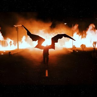 a person standing in front of a large fire with wings spread over their shoulders and arms Halloween Billie Eilish Creative Photography Inspiration, Dark Night Fire Scene, Fantasy Art Background Ideas, black