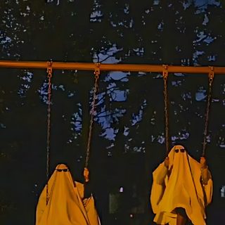 two people in white cloths are on swings at night with trees in the background Best Friend Halloween Two Ghost Aesthetic, Ghost Hunting, Halloween Aesthetic Ghost, black