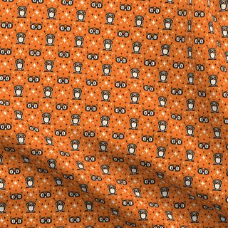 an orange and black patterned fabric with small circles on the bottom, which is very similar to Owl Argyle - Retro Halloween Orange chocolate