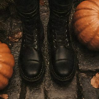 a person wearing black boots standing on top of a brick walkway next to pumpkins Halloween Retro Shoes With Pumpkins Autumn Spooky Aesthetic, Fall Spooky Aesthetic, Spooky Fall Aesthetic, black