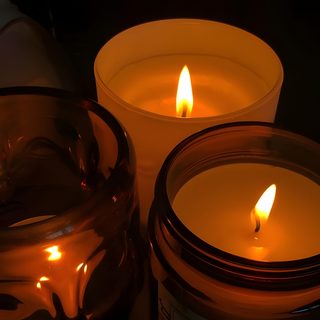 two candles sitting next to each other on a table Halloween Widget Ideas Calm Orange Aesthetic, Fall Candles Aesthetic, Candles Fall Aesthetic, black
